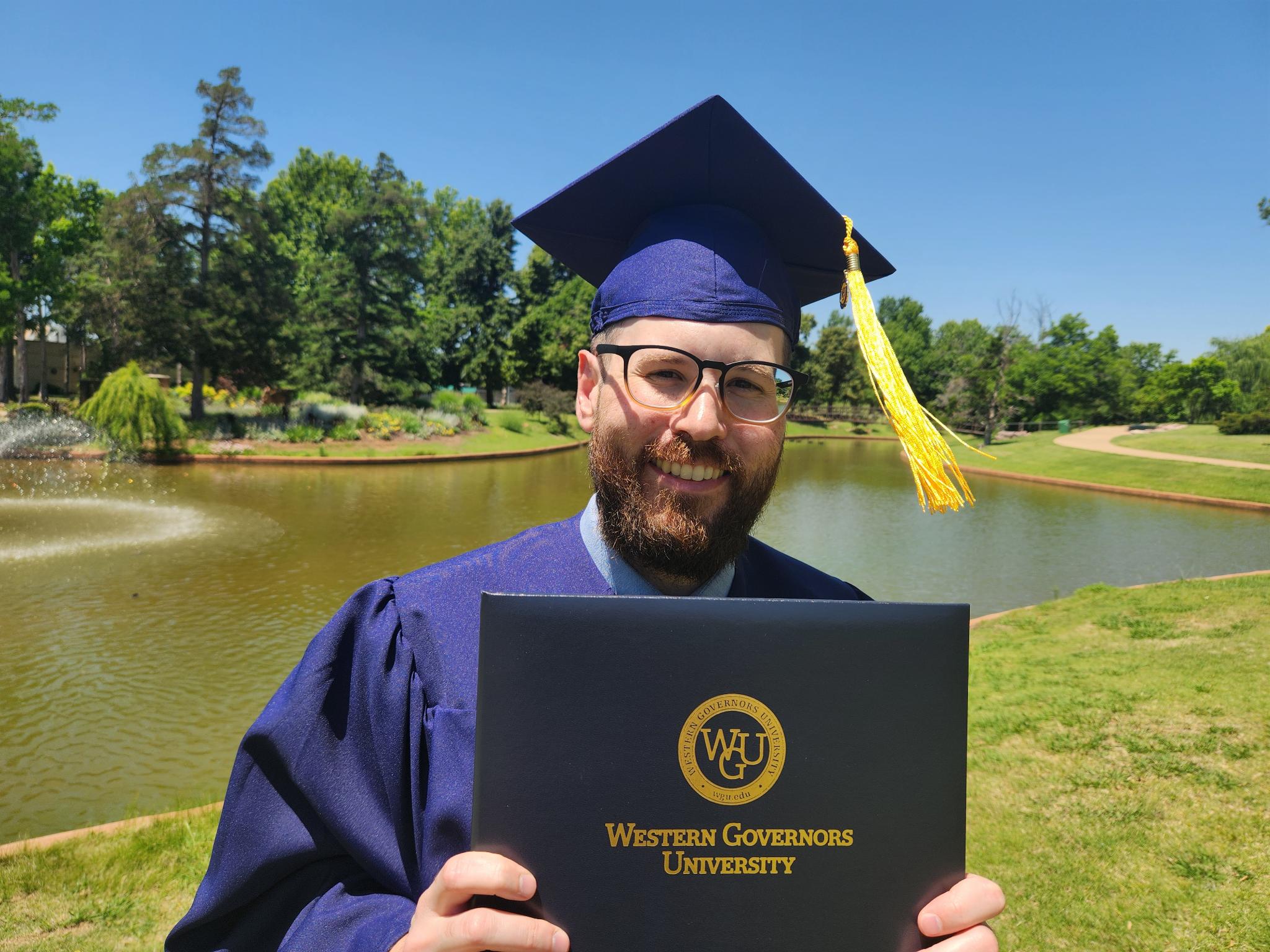 Picture of Christian LeFlore holding a WGU Bachelor’s degree.